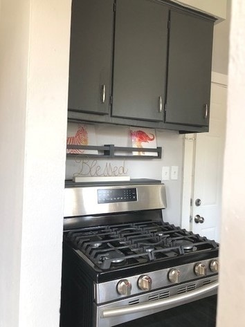 1639 Victoria Ave, North Chicago, IL 60064 - kitchen with gray cabinets and stainless steel range with gas stovetop