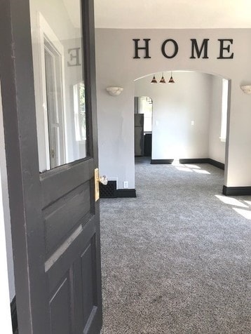 1639 Victoria Ave, North Chicago, IL 60064 - interior space featuring baseboards, arched walkways, and carpet