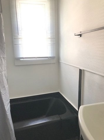 1639 Victoria Ave, North Chicago, IL 60064 - bathroom featuring a sink and a garden tub