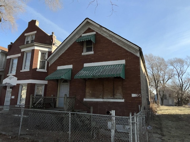 1635 S Kedvale Ave, Chicago, IL 60623 - view of front of house with brick siding, fence, and a chimney