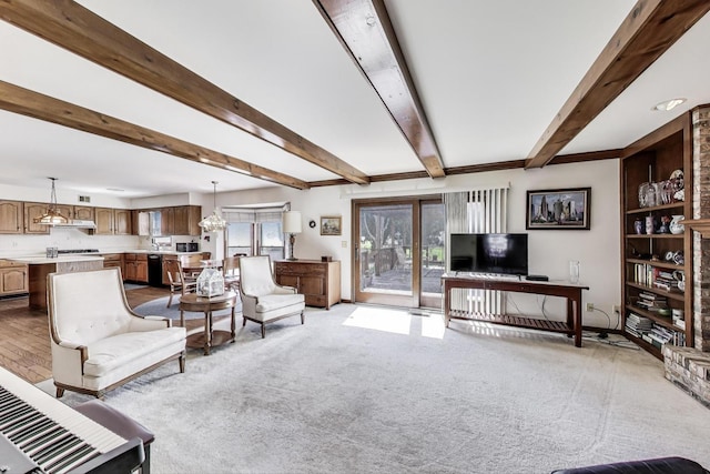 living area with light colored carpet and beam ceiling