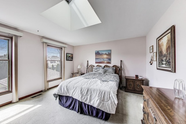 bedroom featuring visible vents, baseboards, access to outside, carpet, and a skylight