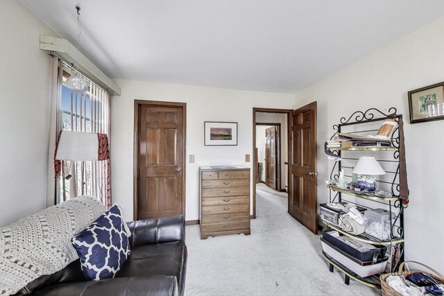 living area featuring light carpet