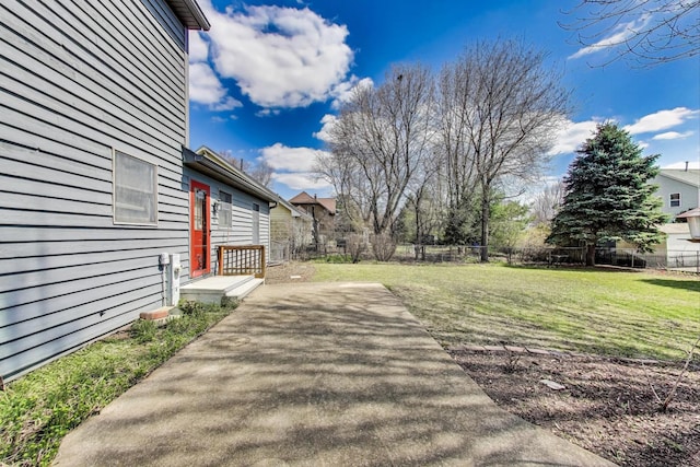 view of yard with a patio and fence