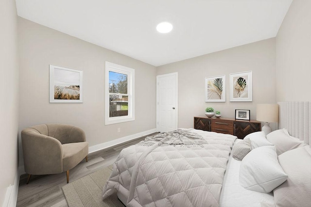 bedroom featuring recessed lighting, baseboards, and wood finished floors