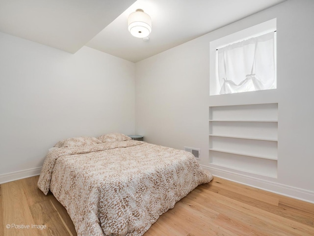 2206 W 107th Pl, Chicago, IL 60643 - bedroom with baseboards, visible vents, and wood finished floors