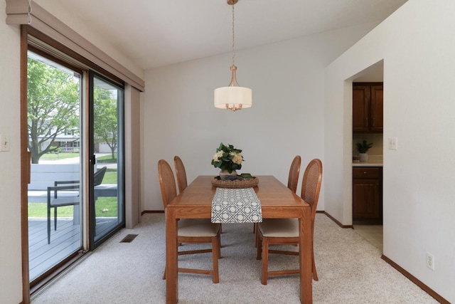 608 Cheshire Dr, Bloomington, IL 61704 - dining room featuring light carpet and baseboards