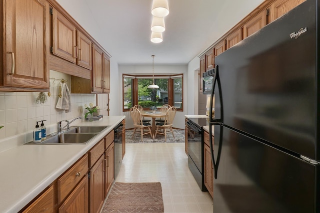 608 Cheshire Dr, Bloomington, IL 61704 - kitchen with black appliances, a sink, light flooring, light countertops, and backsplash