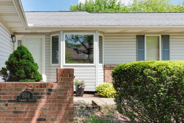 608 Cheshire Dr, Bloomington, IL 61704 - exterior view of brick siding and a shingled roof