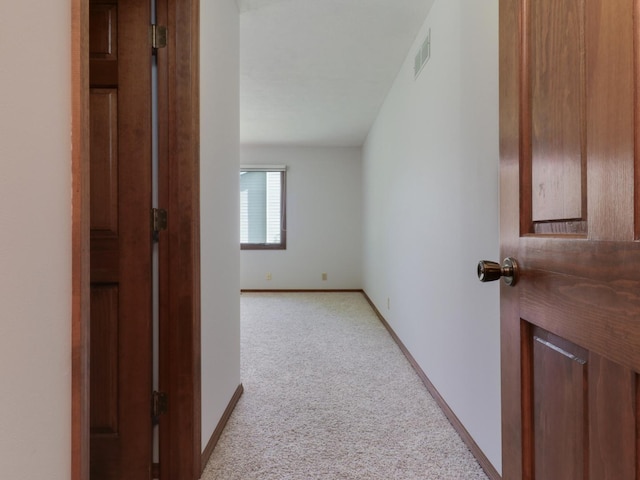 608 Cheshire Dr, Bloomington, IL 61704 - corridor featuring light colored carpet and baseboards