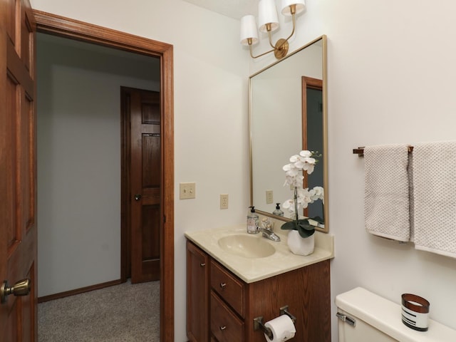 608 Cheshire Dr, Bloomington, IL 61704 - half bathroom featuring vanity and toilet