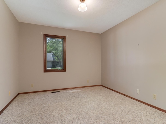 608 Cheshire Dr, Bloomington, IL 61704 - empty room featuring carpet flooring and baseboards