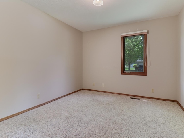 608 Cheshire Dr, Bloomington, IL 61704 - carpeted spare room with baseboards