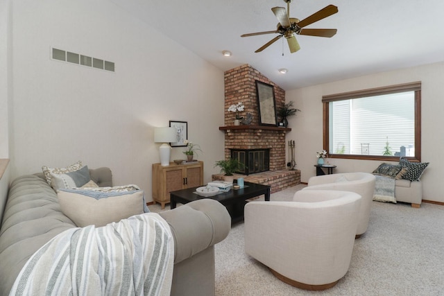 608 Cheshire Dr, Bloomington, IL 61704 - living room with lofted ceiling, ceiling fan, carpet flooring, and a fireplace