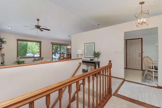 608 Cheshire Dr, Bloomington, IL 61704 - corridor featuring baseboards, carpet floors, an upstairs landing, and a chandelier