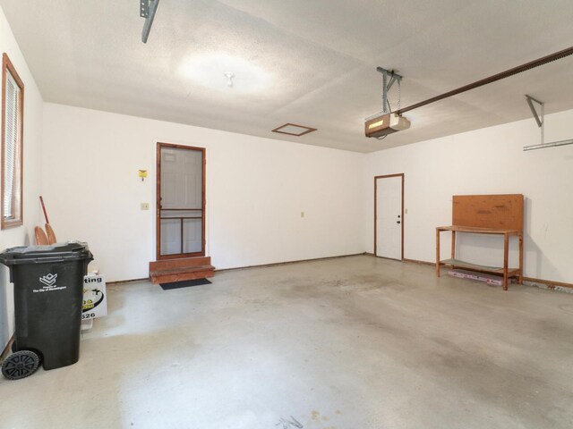 608 Cheshire Dr, Bloomington, IL 61704 - garage featuring a garage door opener