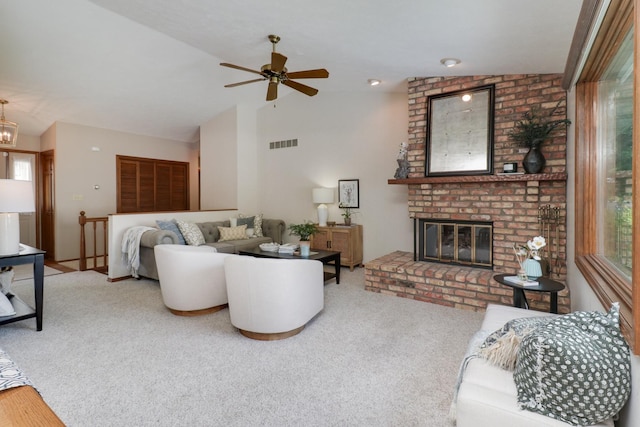 608 Cheshire Dr, Bloomington, IL 61704 - carpeted living area featuring plenty of natural light, lofted ceiling, a fireplace, and a ceiling fan