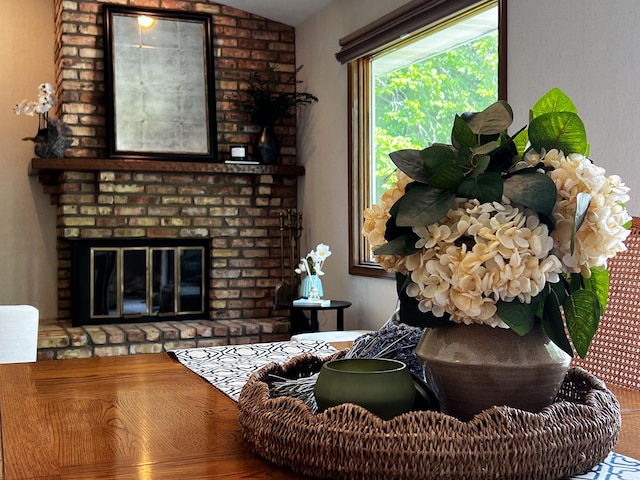608 Cheshire Dr, Bloomington, IL 61704 - living area with lofted ceiling and a brick fireplace