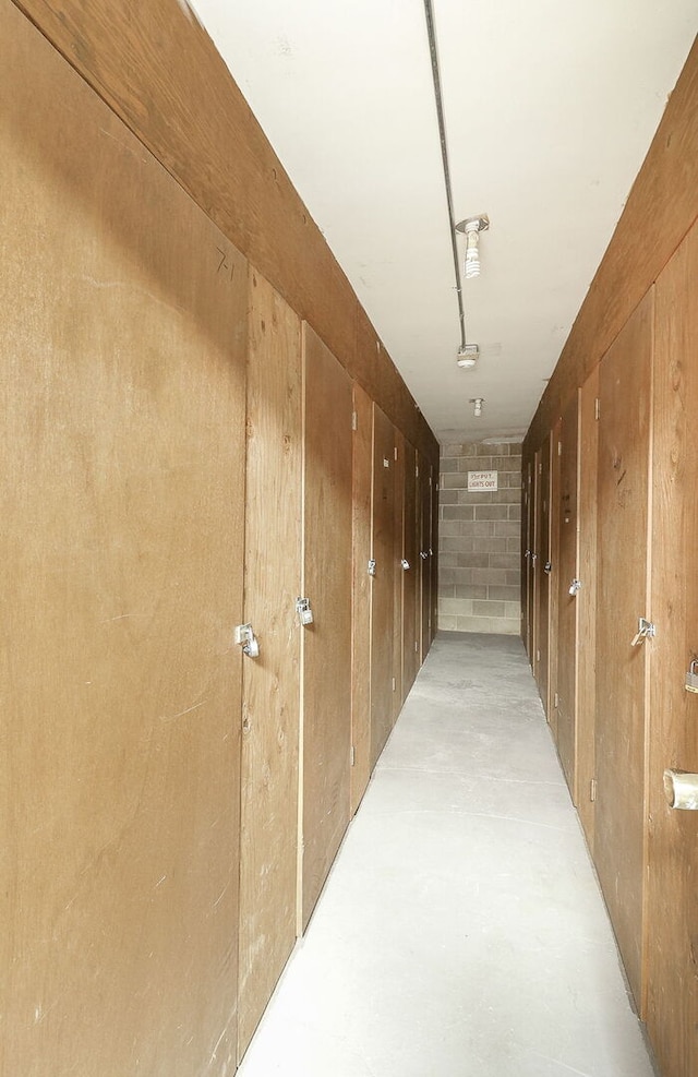 corridor with concrete flooring