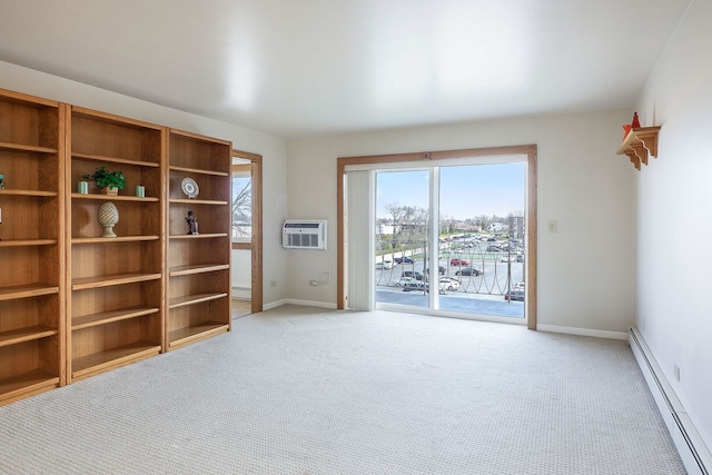 empty room featuring light carpet, a wall mounted AC, a baseboard heating unit, and baseboards