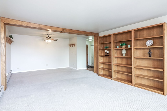unfurnished living room with a baseboard heating unit, carpet flooring, baseboards, and ceiling fan