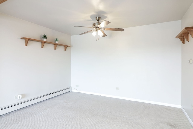 spare room with baseboard heating, ceiling fan, baseboards, and carpet flooring