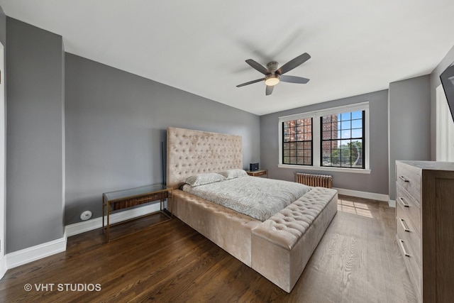 6901 S Oglesby Ave Unit 3A, Chicago, IL 60649 - bedroom with a ceiling fan, radiator heating unit, wood finished floors, and baseboards