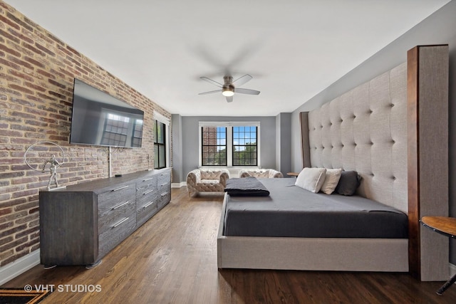 6901 S Oglesby Ave Unit 3A, Chicago, IL 60649 - bedroom featuring baseboards, wood finished floors, a ceiling fan, and brick wall