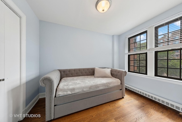 6901 S Oglesby Ave Unit 3A, Chicago, IL 60649 - living area featuring baseboard heating and wood finished floors