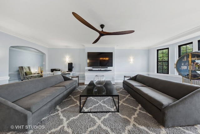 6901 S Oglesby Ave Unit 3A, Chicago, IL 60649 - living area featuring crown molding, a wainscoted wall, arched walkways, and a ceiling fan