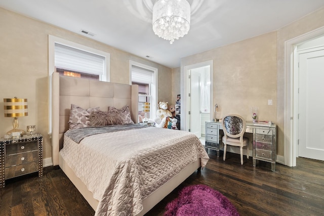 bedroom featuring visible vents, baseboards, an inviting chandelier, and wood finished floors
