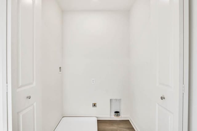 washroom featuring laundry area, hookup for an electric dryer, baseboards, and dark wood-style floors
