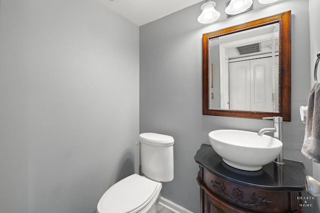 208 Sprucewood Ct, Round Lake Beach, IL 60073 - bathroom with toilet, vanity, and baseboards