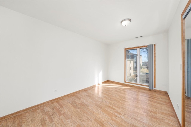 5721 Circle Dr Unit 304, Oak Lawn, IL 60453 - empty room featuring wood finished floors and baseboards