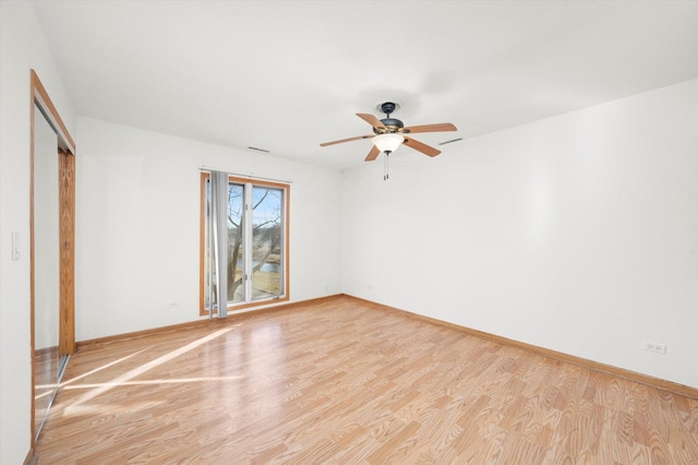 5721 Circle Dr Unit 304, Oak Lawn, IL 60453 - unfurnished bedroom with a closet, light wood-style flooring, baseboards, and a ceiling fan