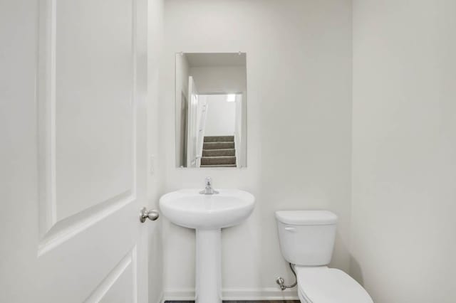 half bath featuring toilet