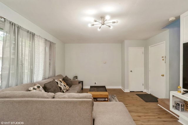 2508 Algonquin Rd Unit 3, Rolling Meadows, IL 60008 - living area featuring a chandelier, wood finished floors, and baseboards