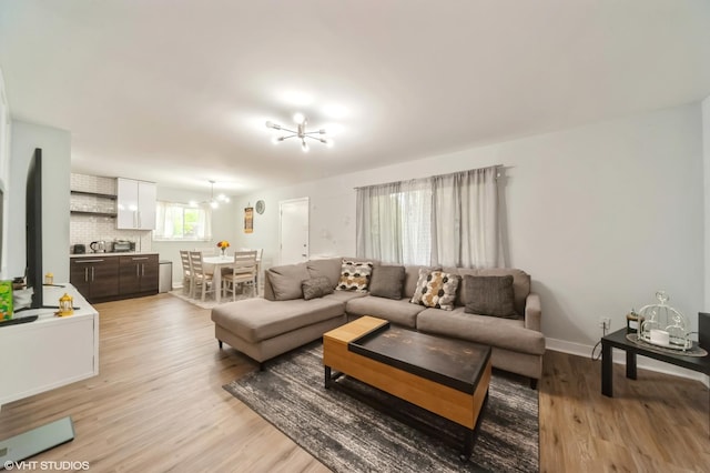 2508 Algonquin Rd Unit 3, Rolling Meadows, IL 60008 - living room with a chandelier and light wood finished floors