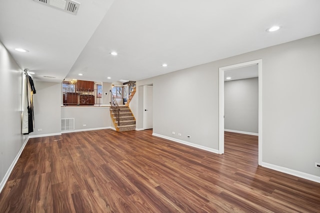 9249 Kildare Ave, Skokie, IL 60077 - unfurnished living room featuring wood finished floors, stairway, and recessed lighting