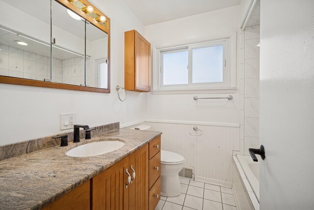 9249 Kildare Ave, Skokie, IL 60077 - bathroom with vanity, a wainscoted wall, tile patterned floors, and bathing tub / shower combination