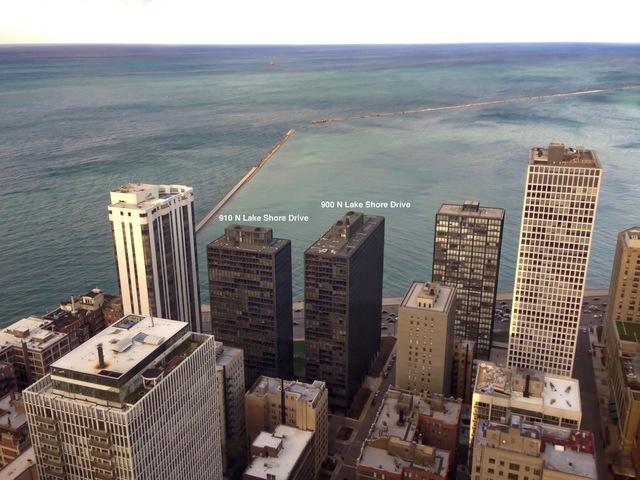 exterior space featuring a water view and a view of city
