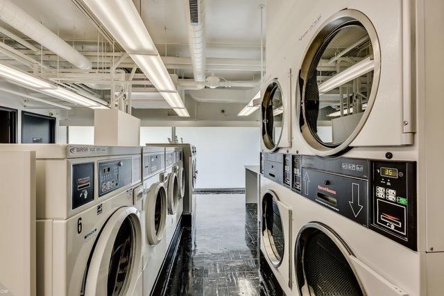 common laundry area with separate washer and dryer and stacked washer / drying machine