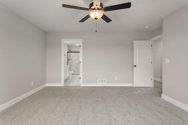 unfurnished bedroom with ceiling fan, light carpet, baseboards, ensuite bathroom, and visible vents