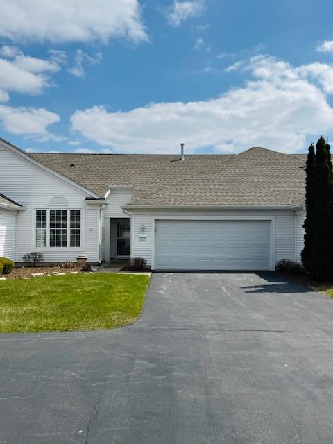 11246 Bellflower Ln, Huntley, IL 60142 - single story home featuring a front yard, roof with shingles, an attached garage, and aphalt driveway