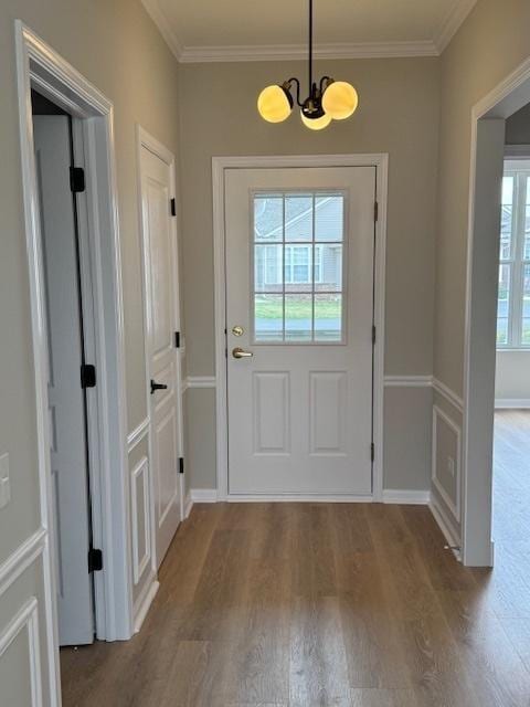 11246 Bellflower Ln, Huntley, IL 60142 - doorway to outside with a chandelier, crown molding, and wood finished floors