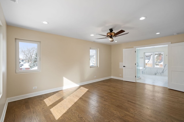 empty room featuring recessed lighting, baseboards, a ceiling fan, and wood finished floors