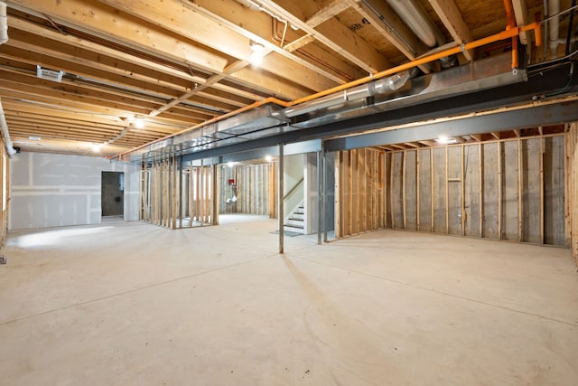 unfinished below grade area with stairs and visible vents