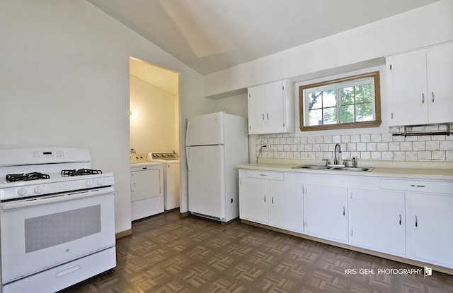 1032 Brentwood Dr, Round Lake Beach, IL 60073 - kitchen featuring white appliances, washer and dryer, lofted ceiling, light countertops, and decorative backsplash