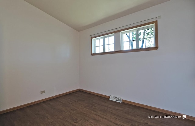 1032 Brentwood Dr, Round Lake Beach, IL 60073 - unfurnished room with lofted ceiling and dark wood-style flooring
