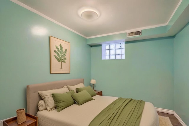 8151 S Bennett Ave, Chicago, IL 60617 - bedroom featuring baseboards, wood finished floors, and visible vents